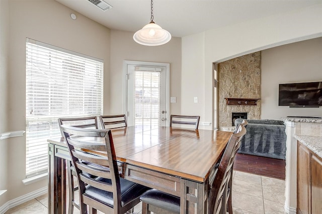 9836 Amaranth Dr, Fort Worth, TX 76177 - dining room with a stone fireplace and baseboards