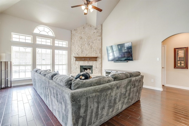 9836 Amaranth Dr, Fort Worth, TX 76177 - living room featuring high vaulted ceiling, ceiling fan, dark wood-style flooring, arched walkways, and healthy amount of natural light