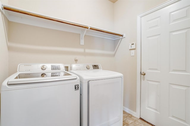 9836 Amaranth Dr, Fort Worth, TX 76177 - laundry room with washing machine and dryer, light tile patterned floors, and baseboards