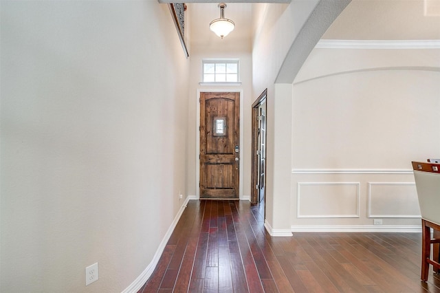 9836 Amaranth Dr, Fort Worth, TX 76177 - entryway featuring arched walkways, dark wood finished floors, baseboards, and crown molding