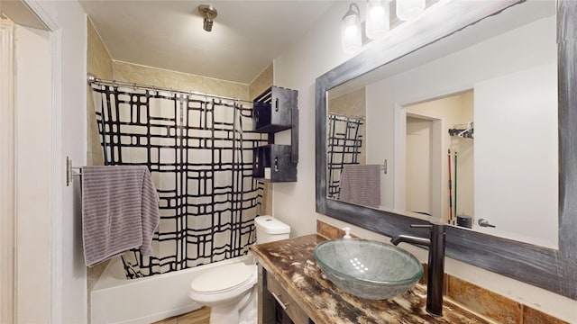 7409 Pebble Beach Dr, Rowlett, TX 75088 - full bathroom featuring vanity, toilet, and shower / bath combo with shower curtain
