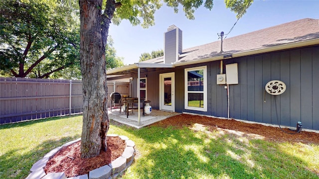 7409 Pebble Beach Dr, Rowlett, TX 75088 - back of house with a chimney, a patio area, and a shingled roof