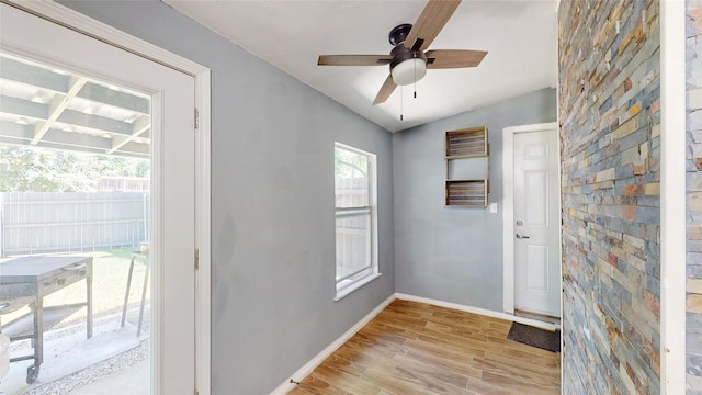 7409 Pebble Beach Dr, Rowlett, TX 75088 - entryway featuring light wood-style floors, baseboards, and ceiling fan