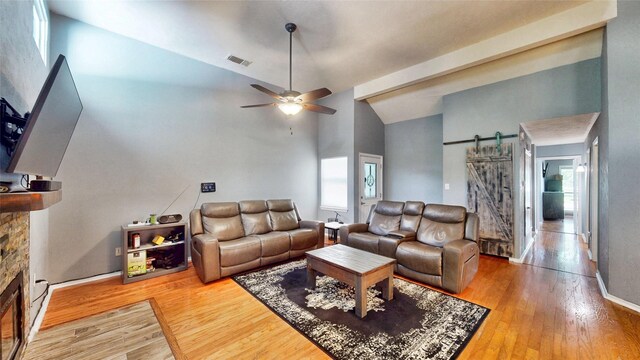 7409 Pebble Beach Dr, Rowlett, TX 75088 - living room with a ceiling fan, wood finished floors, healthy amount of natural light, and high vaulted ceiling