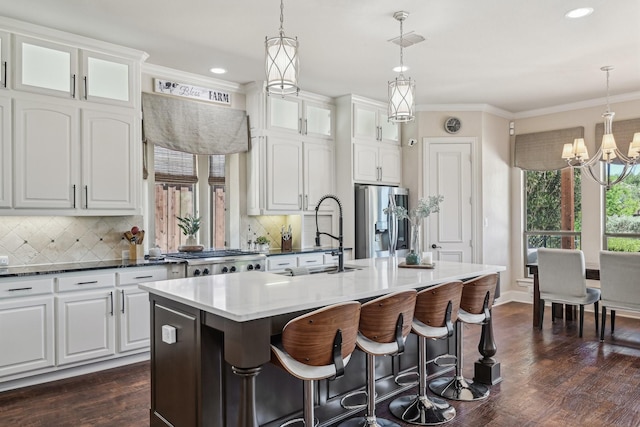 5594 Beacon Hill Dr, Frisco, TX 75036 - kitchen with a sink, stainless steel appliances, a chandelier, plenty of natural light, and crown molding