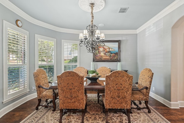 5594 Beacon Hill Dr, Frisco, TX 75036 - dining room featuring a chandelier, ornamental molding, baseboards, wood finished floors, and arched walkways