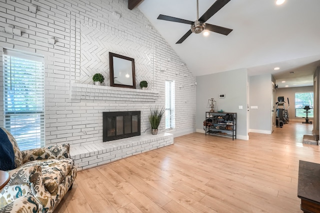 9613 County Road 4091, Scurry, TX 75158 - living area with ceiling fan, high vaulted ceiling, wood finished floors, beam ceiling, and baseboards
