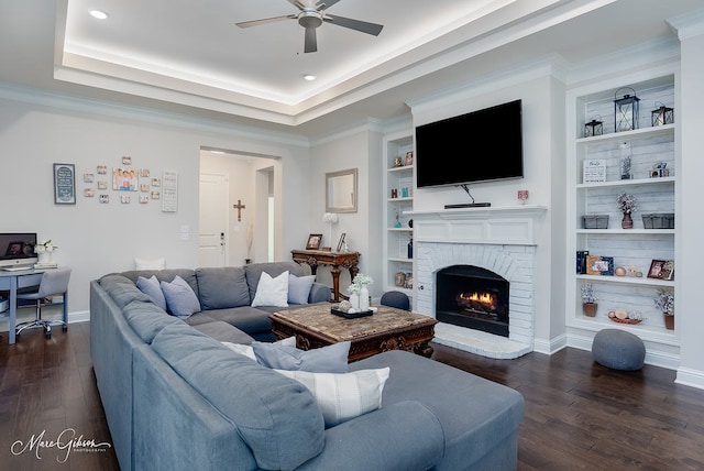 606 Labarre Ln, Bossier City, LA 71111 - living room featuring ceiling fan, dark wood finished floors, a fireplace, an office area, and crown molding