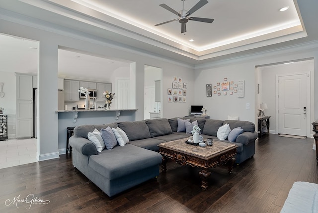 606 Labarre Ln, Bossier City, LA 71111 - living room with a ceiling fan, dark wood-style flooring, recessed lighting, a tray ceiling, and an office area