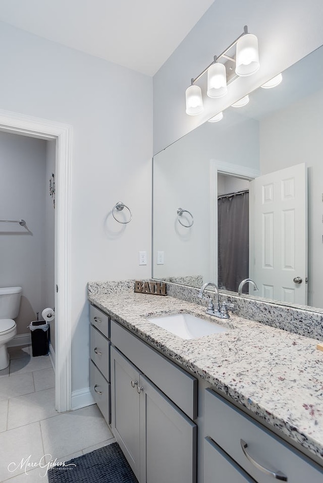 606 Labarre Ln, Bossier City, LA 71111 - full bath with toilet, vanity, tile patterned flooring, and baseboards