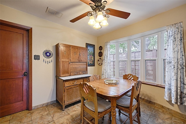 2112 Columbia Dr, Richardson, TX 75081 - dining area featuring ceiling fan and baseboards