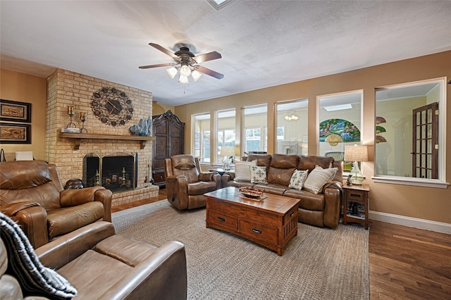 2112 Columbia Dr, Richardson, TX 75081 - living area with wood finished floors, ceiling fan, baseboards, and a brick fireplace