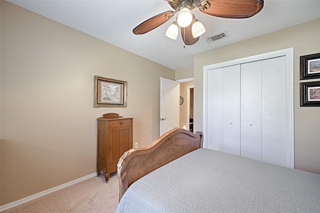 2112 Columbia Dr, Richardson, TX 75081 - bedroom featuring light carpet, baseboards, a closet, and a ceiling fan