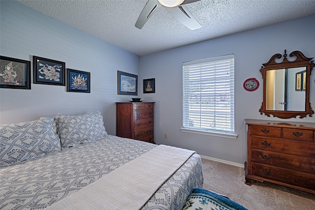2112 Columbia Dr, Richardson, TX 75081 - bedroom featuring carpet floors, a textured ceiling, ceiling fan, and baseboards