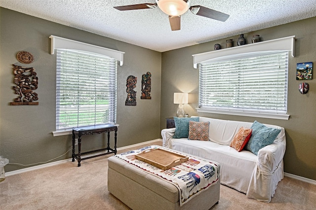 2112 Columbia Dr, Richardson, TX 75081 - living room with a ceiling fan, light carpet, a textured ceiling, a textured wall, and baseboards