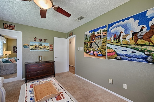 2112 Columbia Dr, Richardson, TX 75081 - carpeted bedroom with a textured ceiling and a ceiling fan