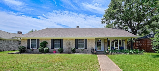 2112 Columbia Dr, Richardson, TX 75081 - ranch-style house featuring a front lawn, brick siding, a chimney, and a porch