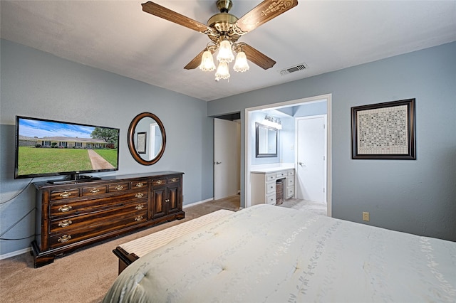 2112 Columbia Dr, Richardson, TX 75081 - bedroom with light carpet, baseboards, a ceiling fan, and ensuite bathroom