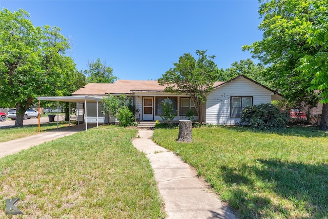 2757 Old Anson Rd, Abilene, TX 79603 - ranch-style house featuring a front yard, driveway, a carport, and covered porch