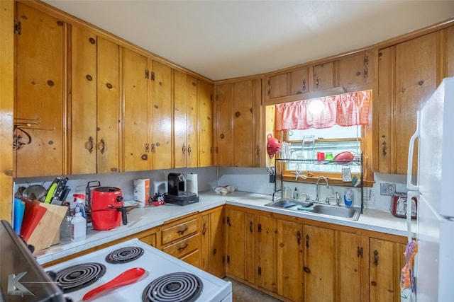 2757 Old Anson Rd, Abilene, TX 79603 - kitchen with white appliances, a sink, light countertops, and brown cabinets