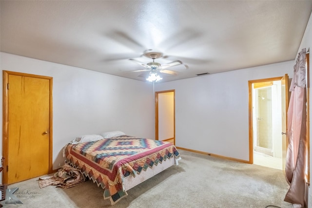 2757 Old Anson Rd, Abilene, TX 79603 - bedroom with light colored carpet, baseboards, a ceiling fan, and ensuite bathroom