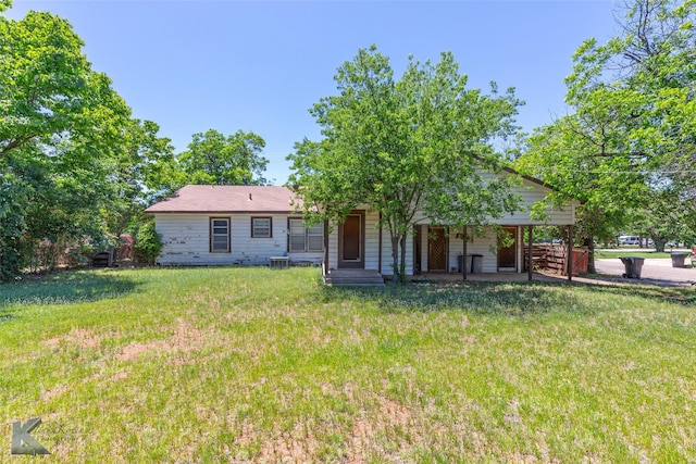 2757 Old Anson Rd, Abilene, TX 79603 - rear view of house with a yard, covered porch, and central AC unit