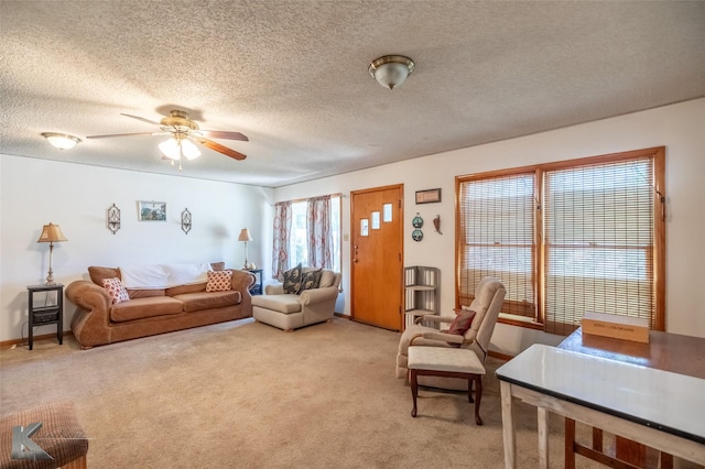 2757 Old Anson Rd, Abilene, TX 79603 - living area featuring a ceiling fan, light colored carpet, and a textured ceiling