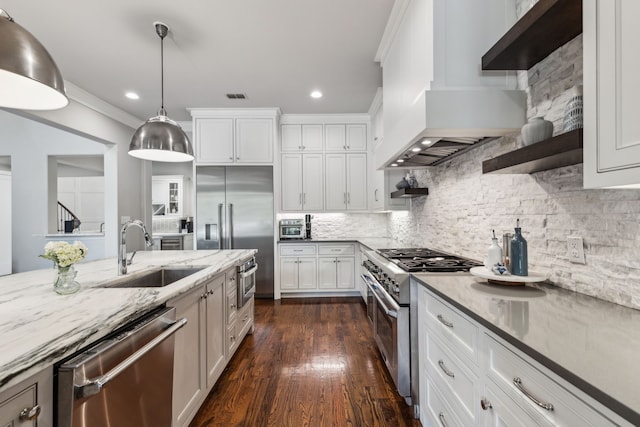 2509 Oak Bend Ct, Southlake, TX 76092 - kitchen with high end appliances, a sink, open shelves, wall chimney range hood, and light stone counters
