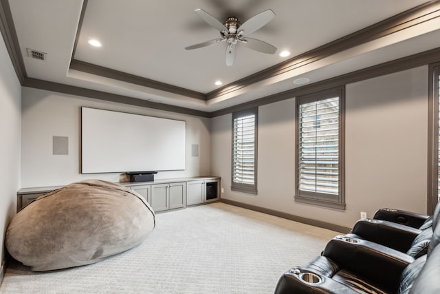 2509 Oak Bend Ct, Southlake, TX 76092 - home theater with a raised ceiling, ornamental molding, a ceiling fan, baseboards, and light colored carpet