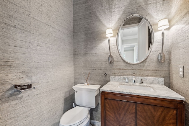 2509 Oak Bend Ct, Southlake, TX 76092 - half bath featuring toilet, vanity, tile walls, and crown molding