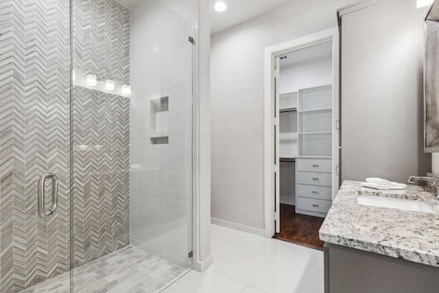 2509 Oak Bend Ct, Southlake, TX 76092 - bathroom featuring vanity, a stall shower, baseboards, and tile patterned floors