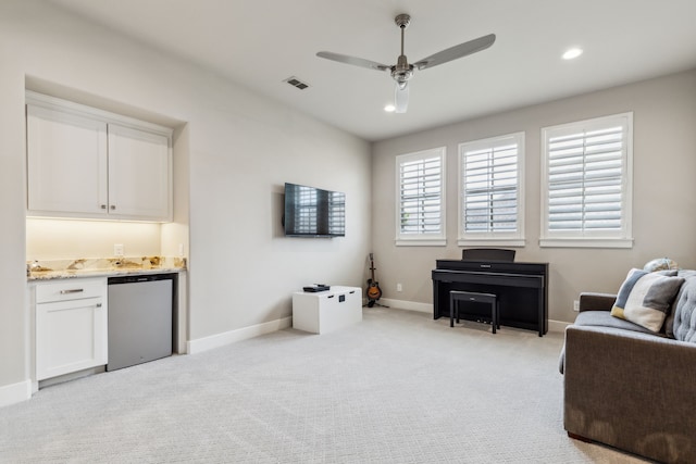 2509 Oak Bend Ct, Southlake, TX 76092 - sitting room featuring bar with sink, ceiling fan, light colored carpet, baseboards, and recessed lighting
