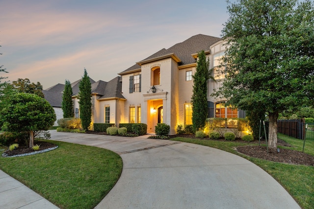 2509 Oak Bend Ct, Southlake, TX 76092 - french country inspired facade featuring curved driveway, a shingled roof, and stucco siding