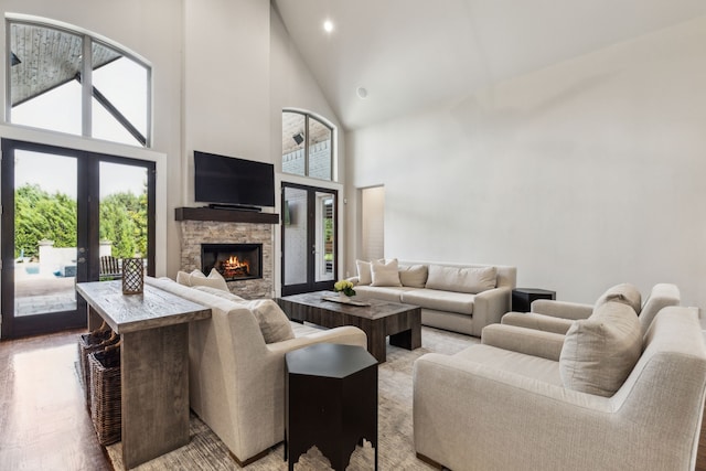 2509 Oak Bend Ct, Southlake, TX 76092 - living room with high vaulted ceiling, french doors, a stone fireplace, plenty of natural light, and recessed lighting