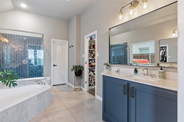 2529 Solomons Pl, Wylie, TX 75098 - full bath featuring a spacious closet, vanity, a bath, tile patterned floors, and tiled shower