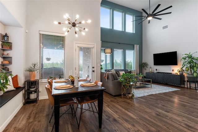 2529 Solomons Pl, Wylie, TX 75098 - dining area with wood finished floors, a chandelier, plenty of natural light, a high ceiling, and a ceiling fan