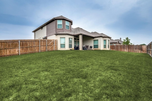 249 Noble Nest Dr, Midlothian, TX 76065 - back of house featuring brick siding and roof with shingles