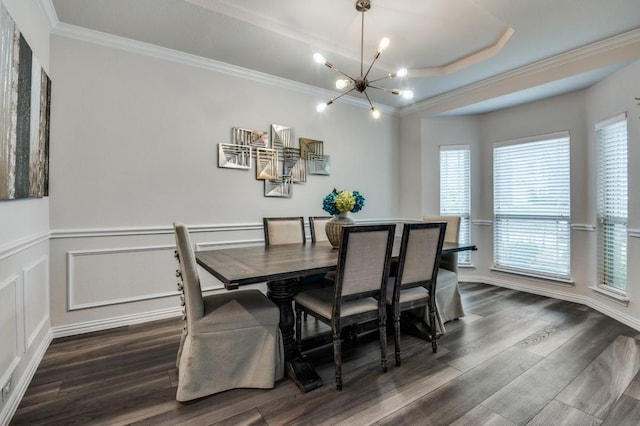 249 Noble Nest Dr, Midlothian, TX 76065 - dining room with a chandelier, crown molding, dark wood finished floors, a raised ceiling, and a wainscoted wall