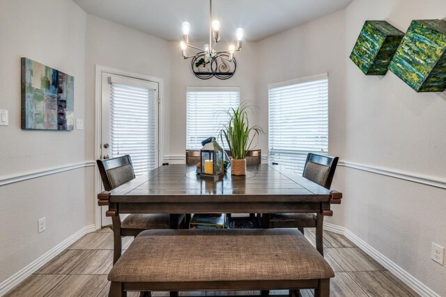 249 Noble Nest Dr, Midlothian, TX 76065 - dining room with a chandelier, light wood-type flooring, and baseboards