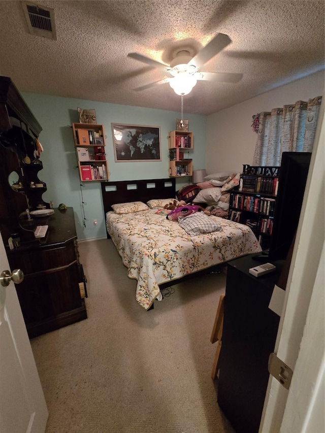 2006 Cori Pl, Sachse, TX 75048 - carpeted bedroom featuring a textured ceiling and a ceiling fan