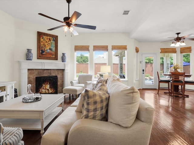 2525 Still Springs Dr, Little Elm, TX 75068 - living room with a ceiling fan, a tiled fireplace, and wood finished floors