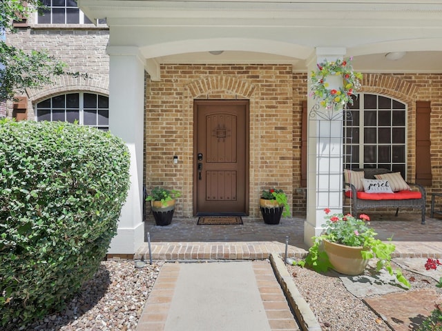 2525 Still Springs Dr, Little Elm, TX 75068 - doorway to property featuring brick siding and a porch