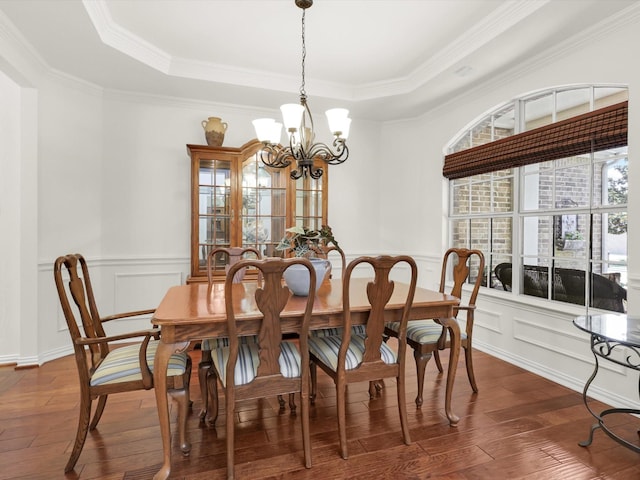 2525 Still Springs Dr, Little Elm, TX 75068 - dining area with a tray ceiling, dark wood-style floors, a chandelier, crown molding, and a wainscoted wall