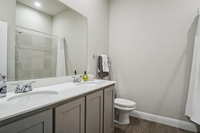 444 Oliver Ct, Argyle, TX 76226 - full bath with toilet, wood finished floors, double vanity, a tile shower, and baseboards