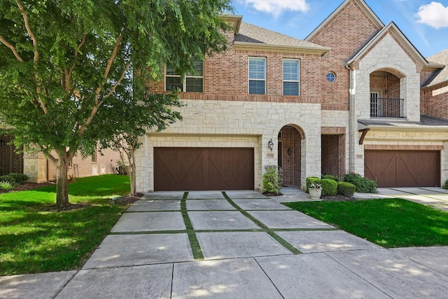 2812 Cedar Elm Dr, Carrollton, TX 75010 - view of front of home featuring a garage, stone siding, a front yard, concrete driveway, and a balcony