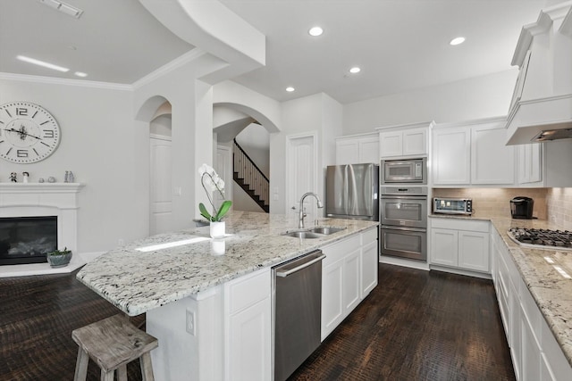 2812 Cedar Elm Dr, Carrollton, TX 75010 - kitchen with stainless steel appliances, a sink, custom exhaust hood, light stone counters, and recessed lighting
