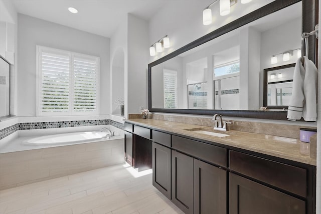 2812 Cedar Elm Dr, Carrollton, TX 75010 - full bath featuring a garden tub, vanity, and a shower stall
