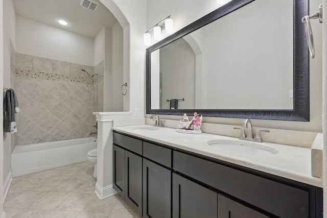 2812 Cedar Elm Dr, Carrollton, TX 75010 - bathroom featuring toilet, double vanity, bathtub / shower combination, and tile patterned floors