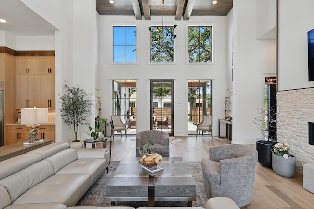 5913 Preston Way, Colleyville, TX 76034 - living area with a towering ceiling, light wood finished floors, healthy amount of natural light, wood ceiling with exposed beams, and recessed lighting