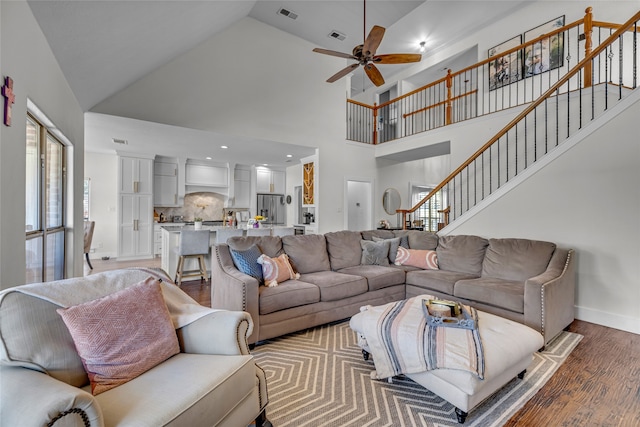 125 Wood Bend Ct, Weatherford, TX 76087 - living area with light wood-style flooring, a ceiling fan, stairway, baseboards, and high vaulted ceiling
